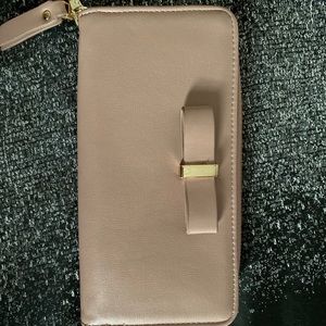 mauve  wallet with gold hardware